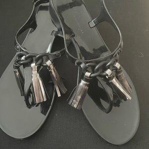 Beautiful Elie Tahari black and silver thong sandals. Never worn come in box.